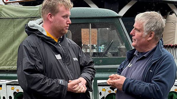 jack talking to a farmer