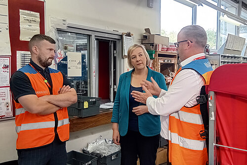 Lisa Smart with two of the staff at Royal Mail’s sorting office in Bredbury